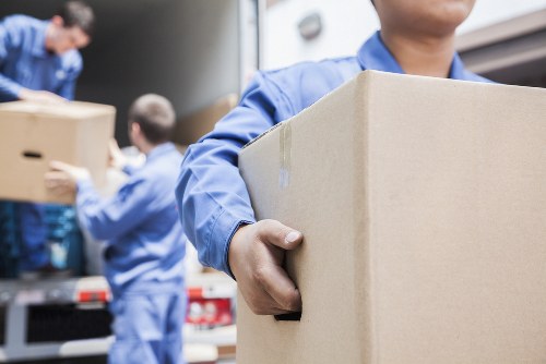 Office relocation planning in Pimlico with packed boxes and moving team