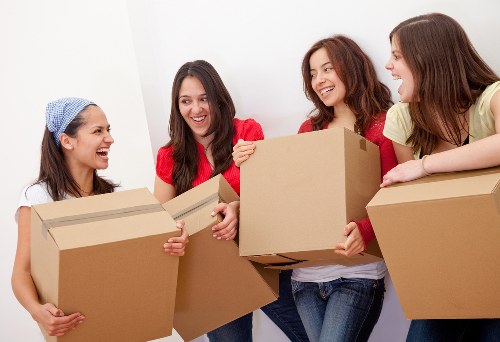 Local moving team handling boxes and household items in Pimlico