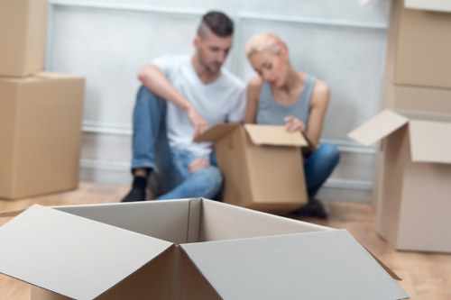 Fragile household items being wrapped for a move in Pimlico