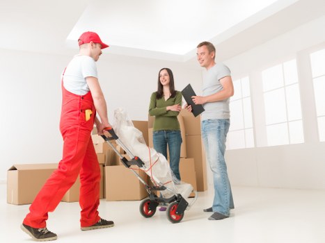 Office relocation logistics with labels, desks, and packing materials