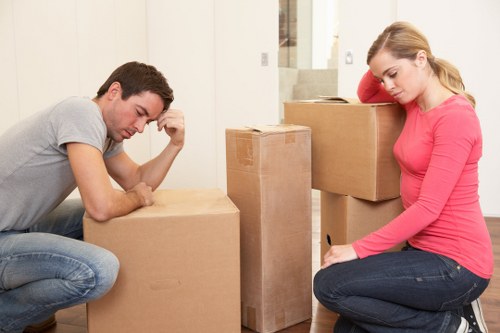 Local movers navigating stairs in a Pimlico apartment building