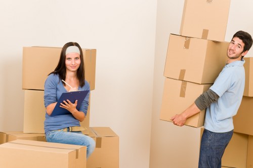Packed boxes and furniture prepared for flat removals in a Pimlico apartment